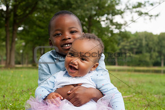 Smiling african boy and his sister