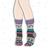 Woman wearing a pair of wool socks. Cute winter background.