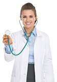 Portrait of smiling doctor woman using stethoscope