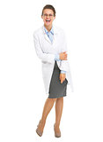 Full length portrait of smiling ophthalmologist doctor woman