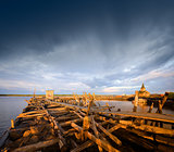 Old wooden pier at sunset.