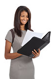 Beautiful african american businesswoman reading a report
