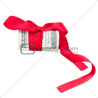 roll of dollars with red bow
