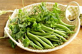 Fresh green beans in a wicker basket