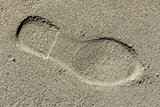 Shoe footprint in the sand