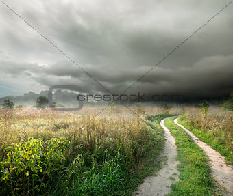 Storm clouds and road