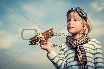 Boy with wooden plane