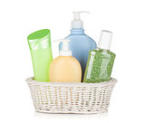 Cosmetics bottles in basket