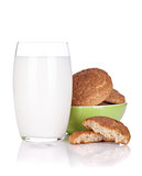 Glass of milk and cookies bowl
