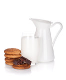 Jug and glass of milk, cookies and chocolate
