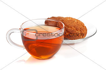 Glass cup of black tea with homemade cookies