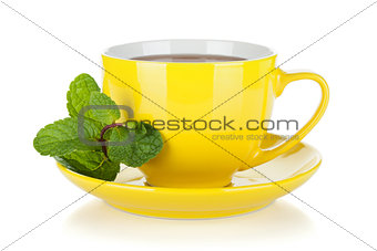 Yellow tea cup with mint