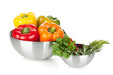 Fresh bell peppers and herbs in bowls