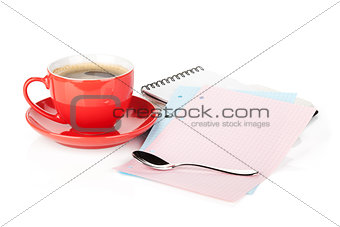 Coffee cup, spoon and office supplies