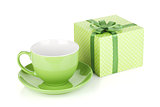 Green coffee cup and gift box with bow