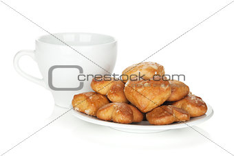 Various cookies in bowl and tea cup
