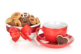 Red coffee cup and cookies