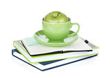Ripe green apple, coffee cup and office supplies
