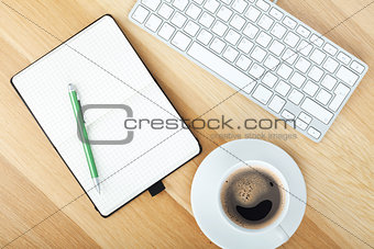 Office supplies, computed keyboard and coffee cup