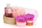 Cosmetics, towel and orchid flowers