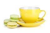 Colorful macarons and coffee cup
