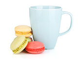 Colorful macarons and coffee cup