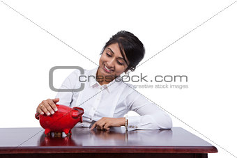 Businesswoman with piggy bank