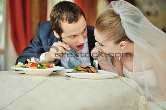 wedding couple together in cafe having fun