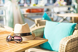 Beach items with straw hat and sunglasses