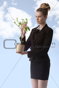 business woman with money plant 