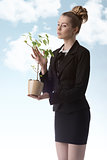 business woman with green money plant 