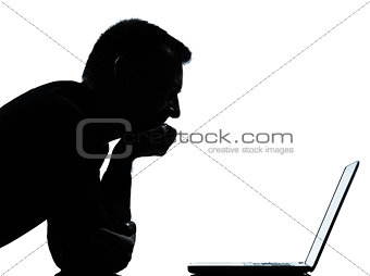 one business man silhouette computing computer laptop smiling