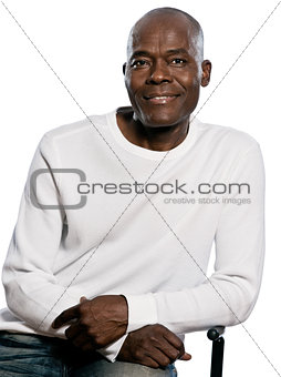 Portrait of a casual mature man sitting on chair