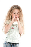 Little girl portrait drinking milk