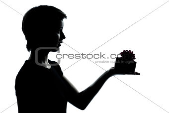 one young teenager boy or girl offering present gift silhouette