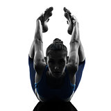 woman exercising yoga bow pose