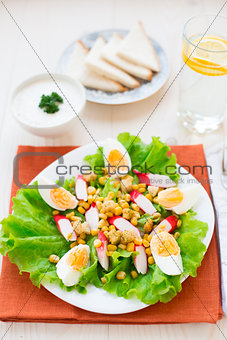 Salad with eggs, crab sticks and corn