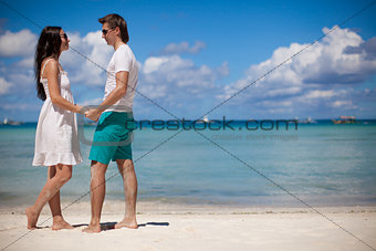 Young couple enjoying each other on a beach