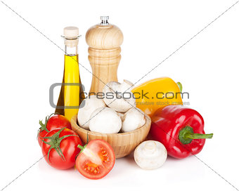 Fresh vegetables and mushrooms with olive oil and pepper shaker