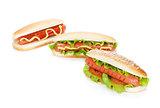 Three hot dogs with various ingredients