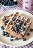 Breakfast with belgian waffles and fresh blueberry