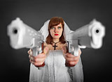 Beautiful bride armed with two pistols