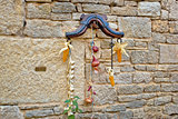 Traditional Dalmatian ornament on stone wall