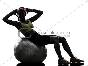 woman exercising crunches fitness ball workout  silhouette