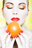 Woman portrait smell orange fruit