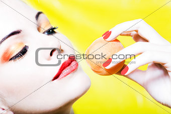 Woman portrait holding an apricot