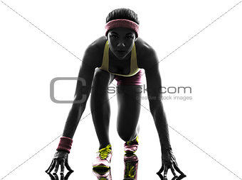 woman runner running on starting blocks silhouette