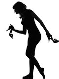 silhouette woman walking quite barefoot on tiptoe