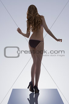 woman in bikini on trampoline