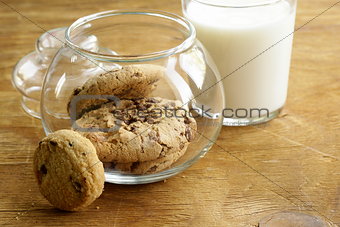 breakfast cookies with chocolate and milk on a wooden table